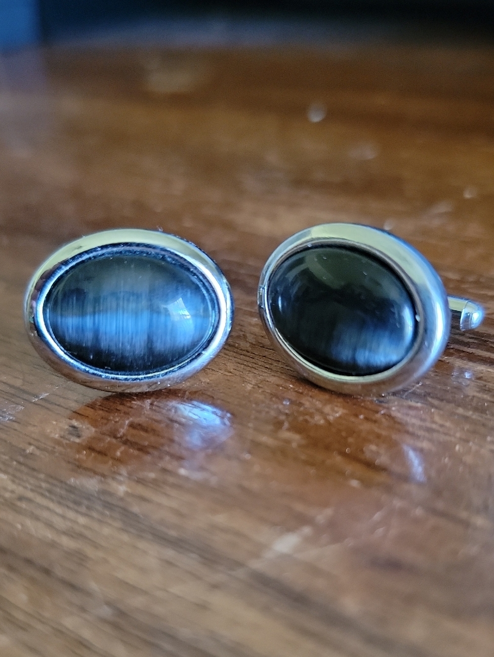 Unk Silver-Tone Oval Cufflinks with Dark Cat's Eye Stones